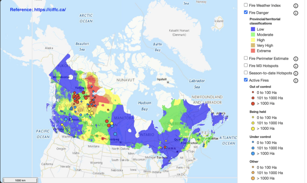 Screenshot of the interactive CIFFC Canadian wildland fire map displaying nationwide fire danger levels ranging from low to extreme alongside active fire locations categorized as out of control, being held, and under control across Canada.